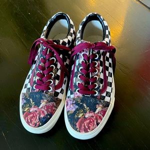Customized checkered and floral patterned Van's tennis shoes.